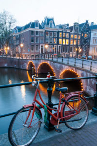 Bicycle at the handrail, dusk, 'Leidsegracht', corner 'Keizersgracht', Amsterdam, Holland, Netherlands Bicycle at the handrail, dusk, 'Leidsegracht', corner 'Keizersgracht', Amsterdam, Holland, Netherlands